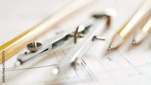Drawing and drawing tools, compasses, pencils, ruler. The concept of teaching in high school architecture. 4K video with shallow depth of field focus on objects. Close view and very smooth dolly shot