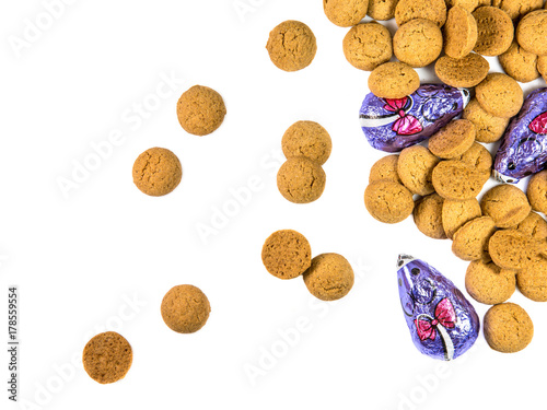 Bunch of scattered Pepernoten cookies and chocolate mice