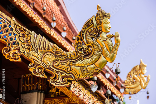 Gable End of Temple Roof, the saluting angle out of mouth of Naga, Wat Phra Sing - Chiang Rai, Thailand photo