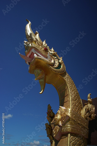 Golden Naga Statue  a symbol of mystical  great and wise serpents