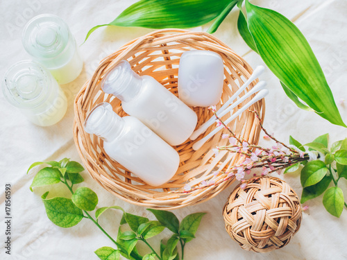 Bathroom accessories. Shower gel, body lotion, shampoo on fabric background for the bath.