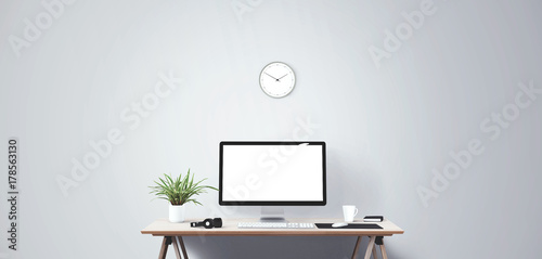 Computer display and office tools on desk. Desktop computer screen isolated. Modern creative workspace background. Front view.