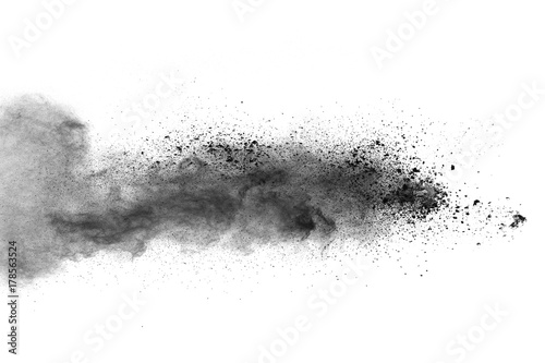 black powder splatted on white background.