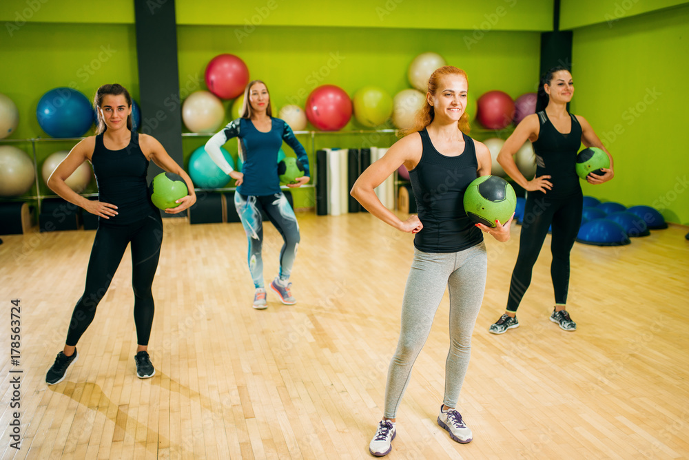 Women group with balls on fitness training