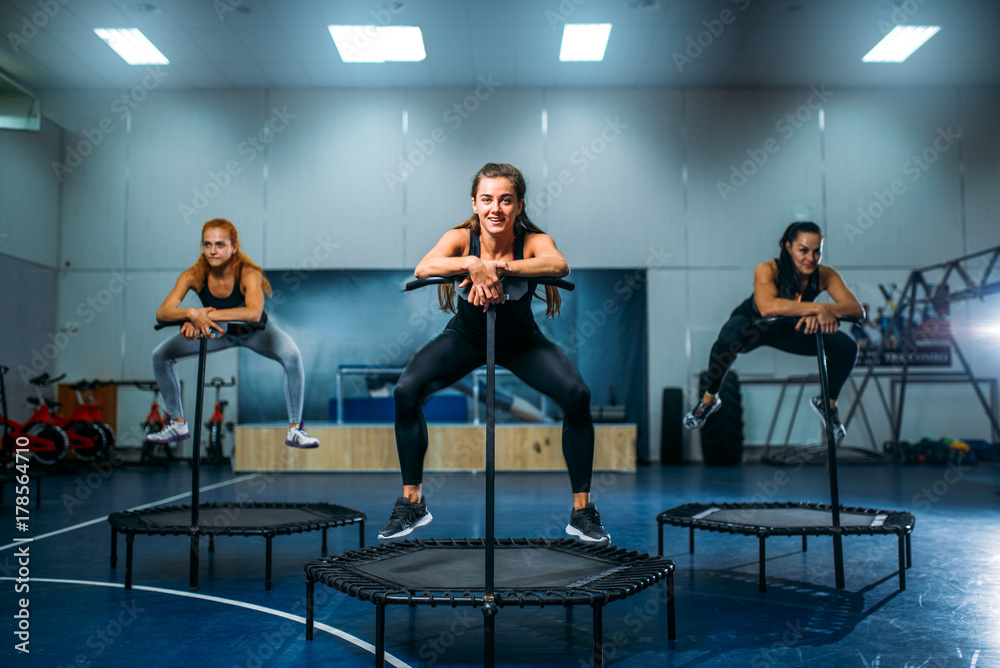 © Nomad_Soul - Women on trampoline in motion, fitness training