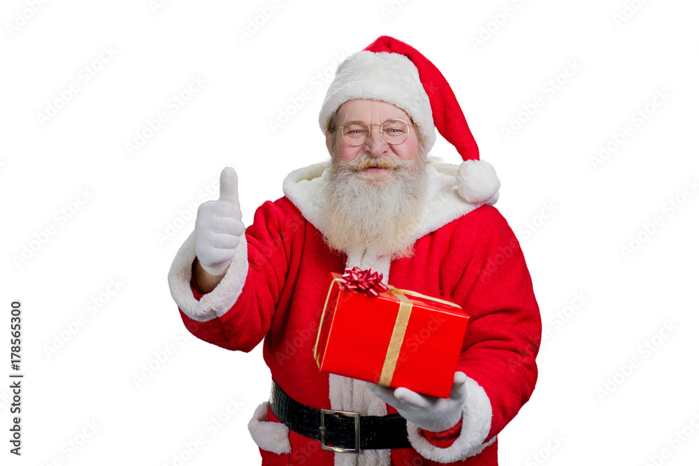 Happy Santa Claus giving thumb up. Portrait of realistic Santa Claus with Christmas present giving thumb up gesture on white background. Christmas happiness and gifts. Happy Santa Claus giving thumb up. Portrait of realistic Santa Claus with Christmas present giving thumb up gesture on white background. Christmas happiness and gifts.