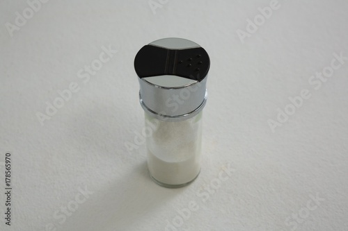 Salt shaker on white background