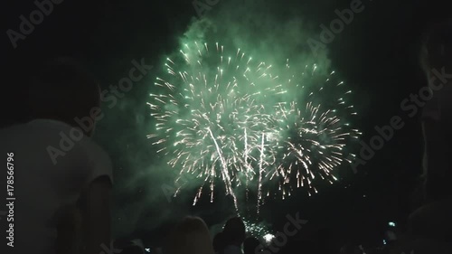 people look beautiful fireworks in the evening on holiday photo