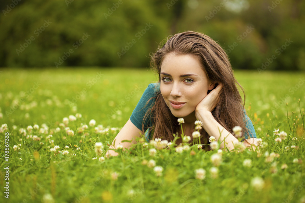 Gorgeous young pretty woman relaxing in summer park Gorgeous young pretty woman relaxing in summer park