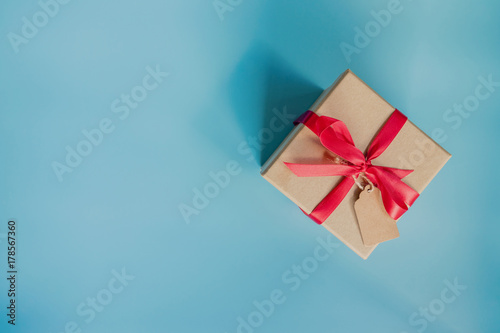 top view brown gift box for new year on blue pastel color background with space.