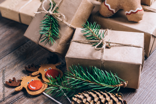 Christmas Gifts with Boxes on Wooden Background. Vintage Style. Closeup, selective focus.