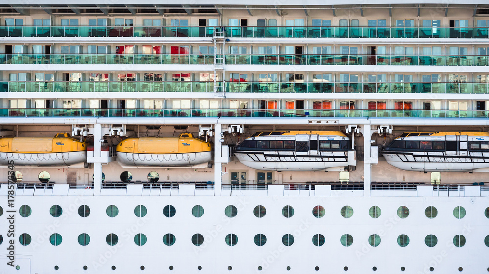 Luxury cruise ship docked at port.