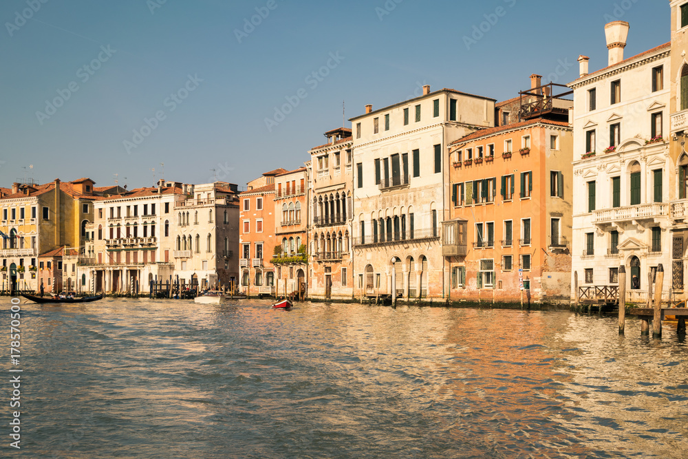 Historic buildings on the banks of the grand canal in Venice.