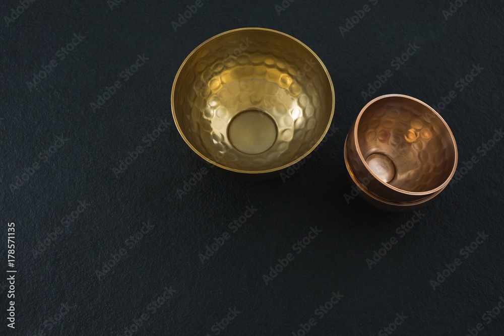 Golden steel bowls on table