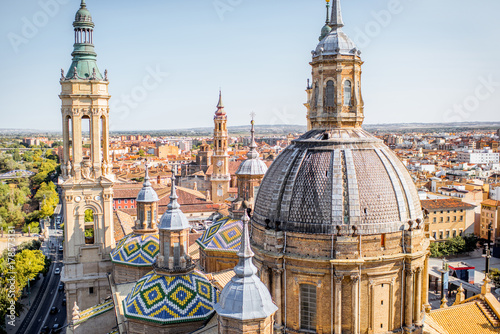 Aerial cityscape view on the roofs and spires of basilica of Our Lady in Zaragoza city in Spain