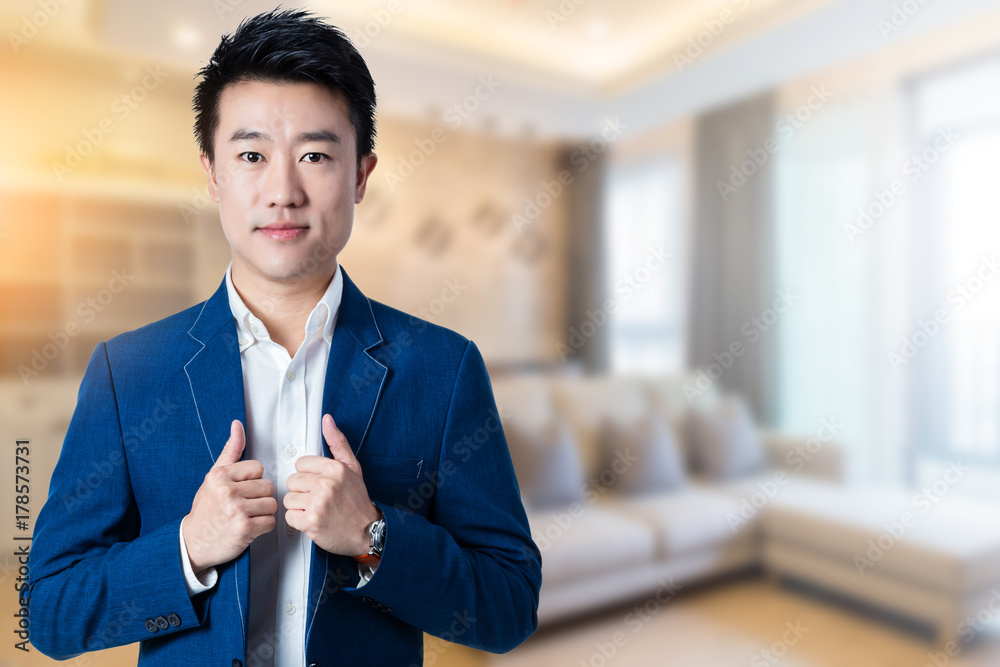 asian business man with blur image background of room interior design asian business man with blur image background of room interior design