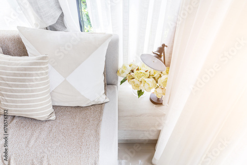 contemporary interior of Living room with part of sofa in sunny day and white curtain interior background concept