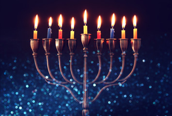 jewish holiday Hanukkah background with menorah (traditional candelabra) and burning candles