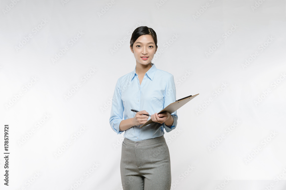 Business woman take note on clipboard Business woman take note on clipboard