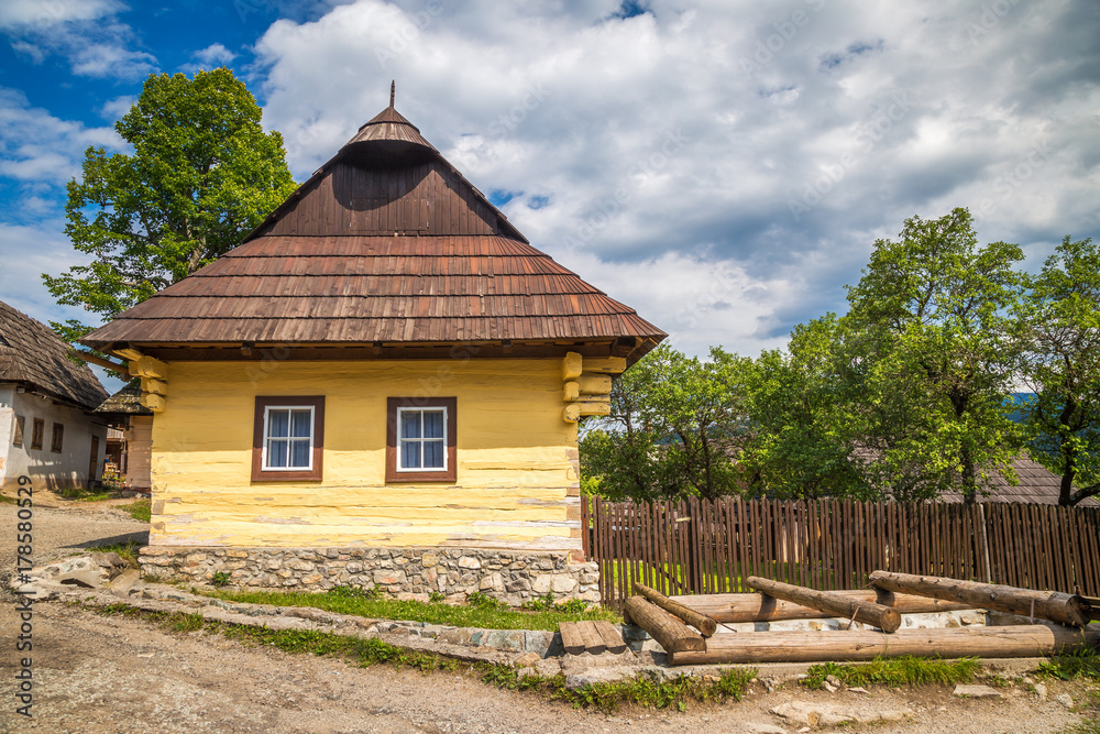 An ancient colorful house in the Vlkolinec village, Slovakia, Europe. An ancient colorful house in the Vlkolinec village, Slovakia, Europe.