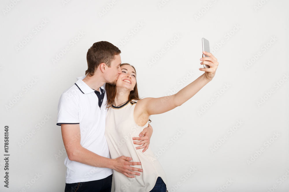 Happy couple taking selfie on smartphone Happy couple taking selfie on smartphone