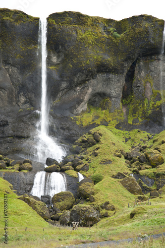 Typical Icelandic landscape  a wild nature of rocks and shrubs  rivers and lakes.