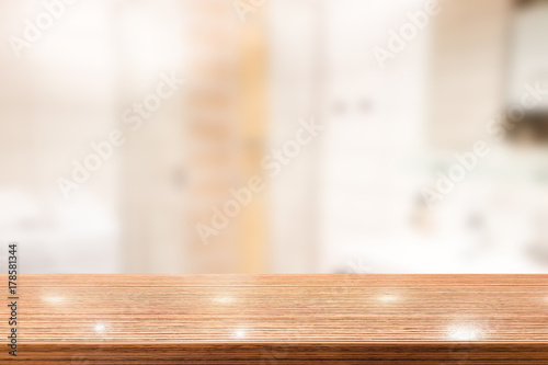 Wood table top with blur bathroom interior to promote your products