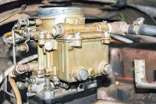 Old carburetor on an Vintage car engine