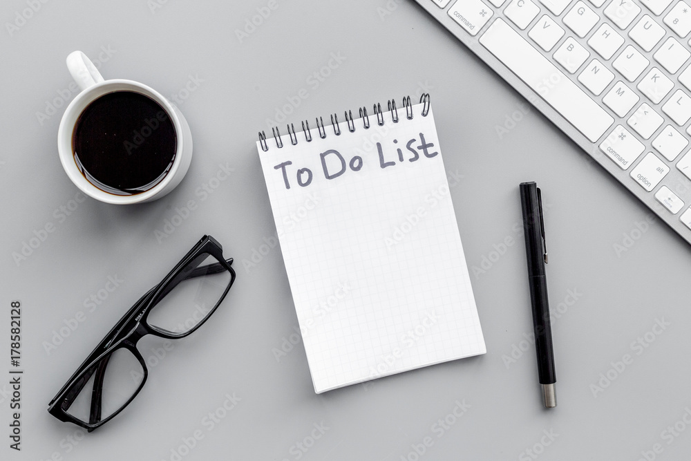 To do list for businessman in notebook on office table. Grey background top view mockup To do list for businessman in notebook on office table. Grey background top view mockup