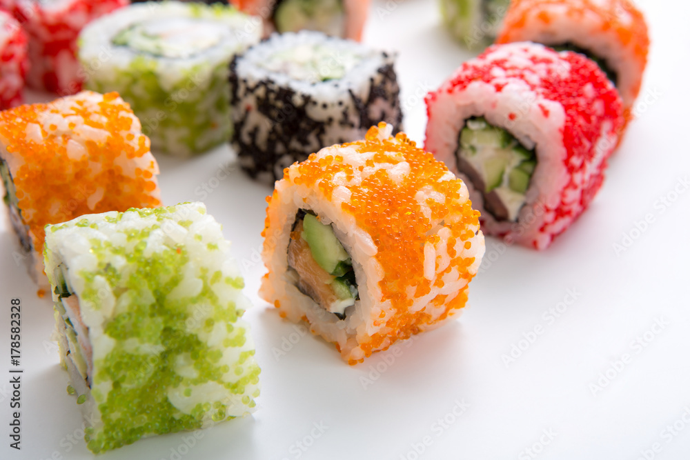 Closeup set of sushi rolls,maki on white background copy space Closeup set of sushi rolls,maki on white background copy space