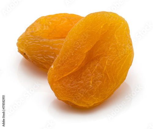 Two whole dried apricots isolated on white background