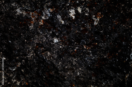 Abstract dark background. The texture of the stone. Blank space design solutions © Yuli