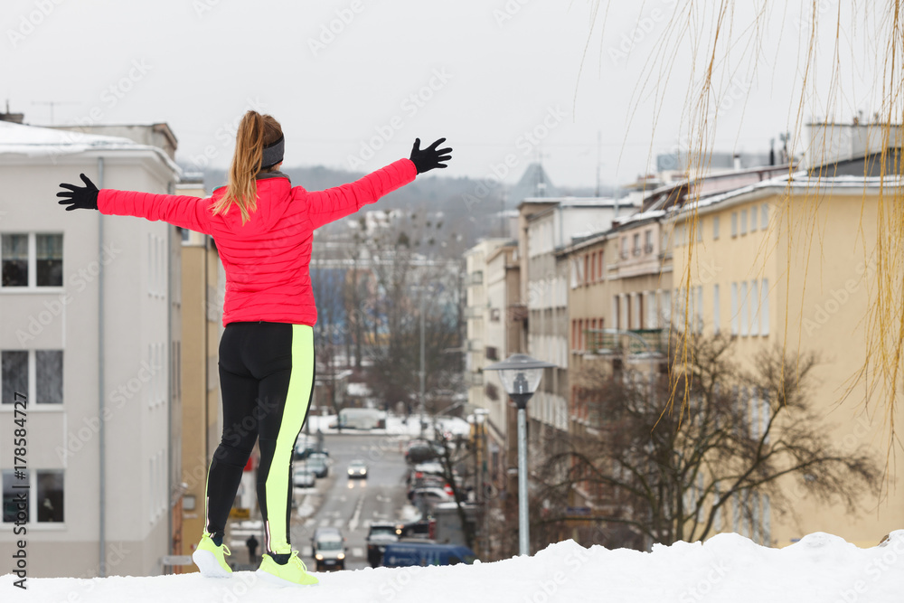 Woman exercising during winter