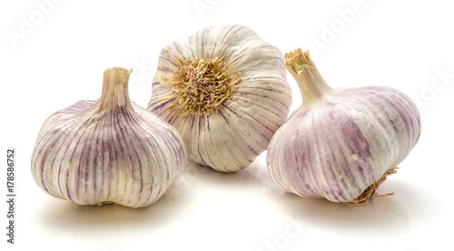 Three whole garlic bulbs isolated on white background