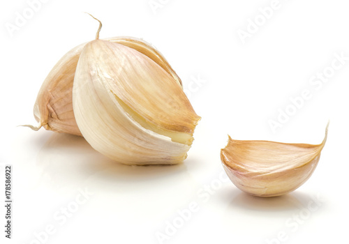 Three garlic cloves isolated on white background