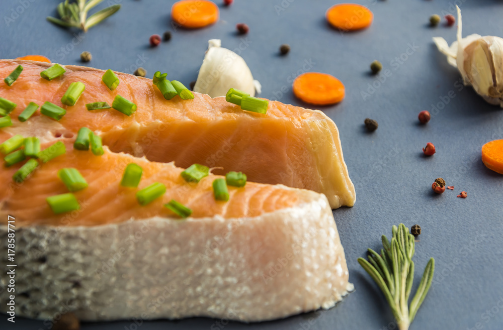 Raw salmon with spice rosemary,black pepper peas,garlic and carrot slice Raw salmon with spice rosemary,black pepper peas,garlic and carrot slice