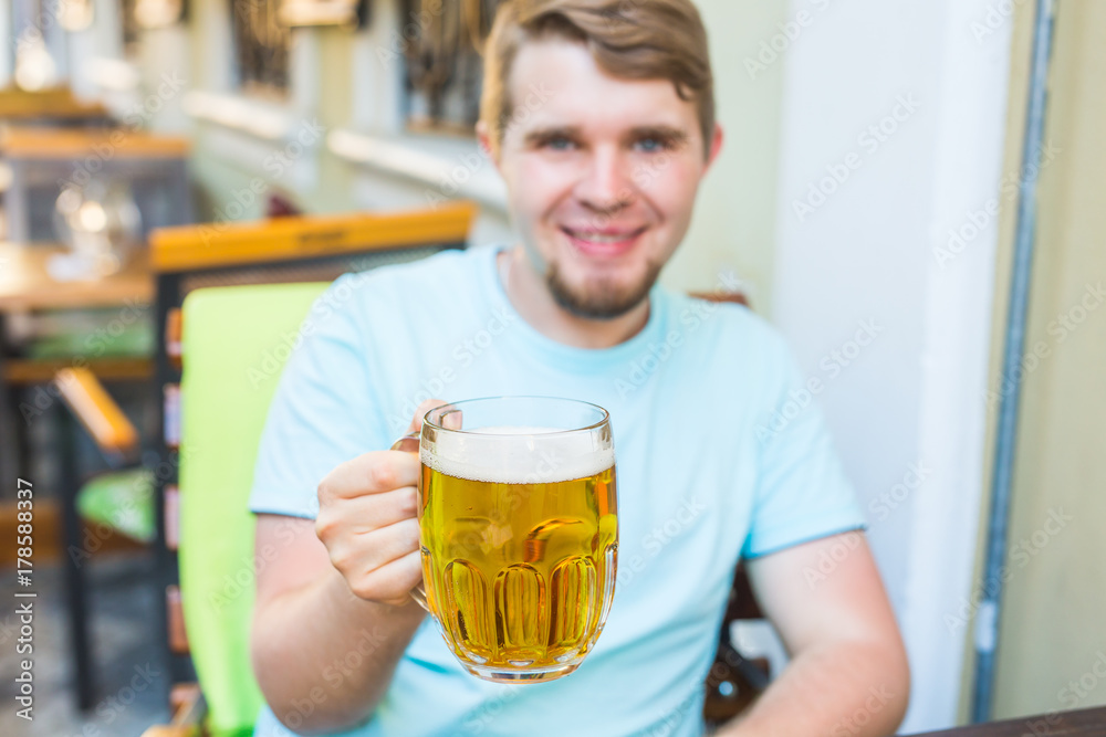 Bearded man drinking beer from a beer mug. Bearded man drinking beer from a beer mug.