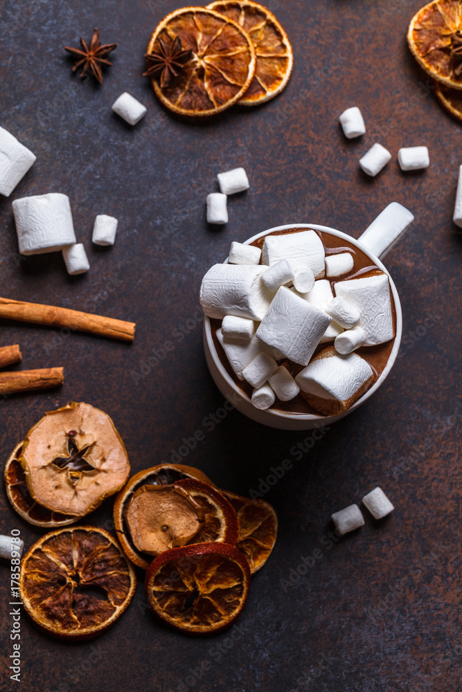 Christmas cookies in a white wooden box with hot chocolate and marshmelow, on a dark background, hands Christmas cookies in a white wooden box with hot chocolate and marshmelow, on a dark background, hands