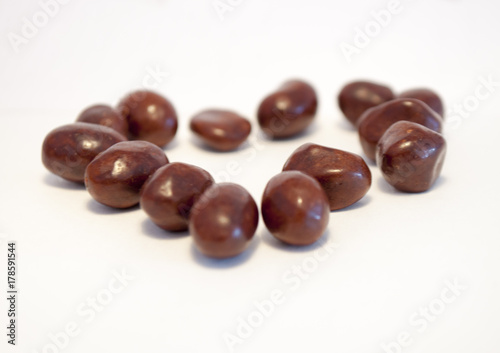 Peanuts in chocolate isolated on white background.