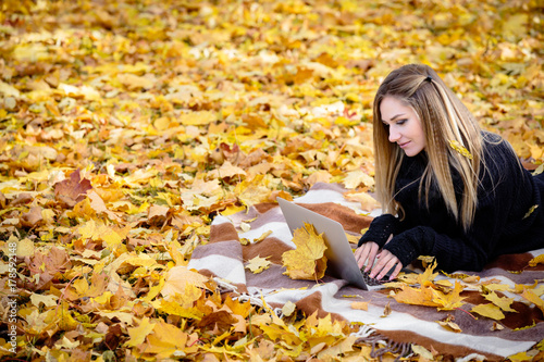 young blond woman in autumn Park