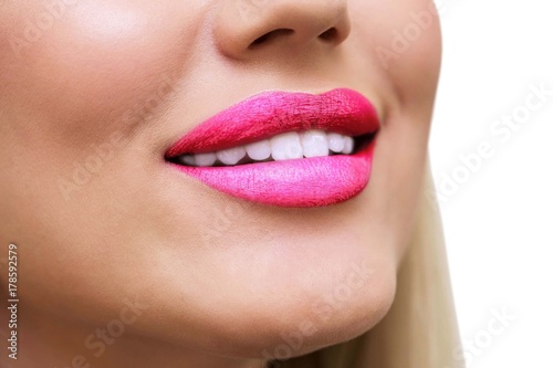 Sexy  Beauty pink Lips  Makeup Detail. Closeup. lipstick or Lipgloss. Blonde woman smiling on white isolate background. Clean white teeth. Medicine  healthy lifestyle  beauty care concept