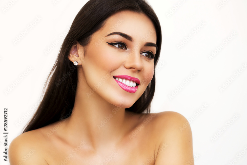 Beauty Spa Woman with perfect skin Portrait. Brunette Girl. beautiful makeup, pink lips, shoulder, white isolated background. White healthy teeth, smiles, happiness, emotion, Care, clear skin. Beauty Spa Woman with perfect skin Portrait. Brunette Girl. beautiful makeup, pink lips, shoulder, white isolated background. White healthy teeth, smiles, happiness, emotion, Care, clear skin.