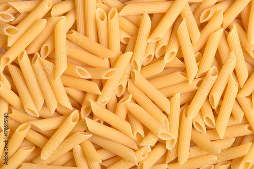 A lot of pasta. Dry pasta. Broken macaroni. Pasta. Pasta. Macaroni background. Food background.