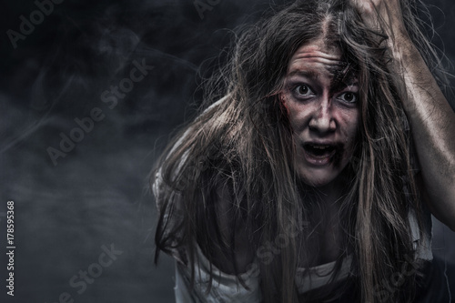 Zombie woman  Horror background for halloween concept and book cover. Copy space.