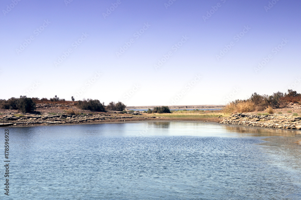 View of a Lake Under a Clear Blue Sky