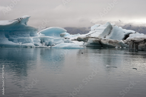 Panoramic Jokulsarlon  Typical Icelandic landscape  a wild nature of seals and icebergs  rocks and water.