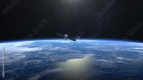 Two satellites scan and monitor the Earth. Satellites flying from camera far away quickly. The earth rotates slowly. 4K.