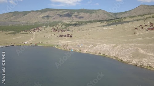 Tranquil Aerial View of the Baikal Bay Shamanka. Olkhon Island, Baikal, Russia, Siberia. Drone footage.