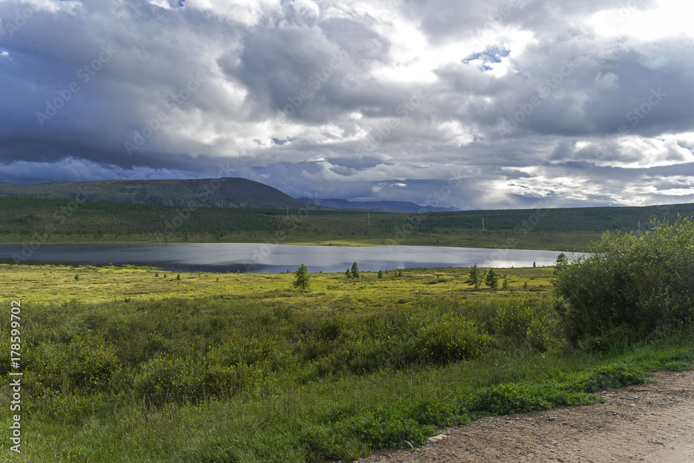 Lake in the foothills of the Eastern Sayan mountains. Siberia, Russia.