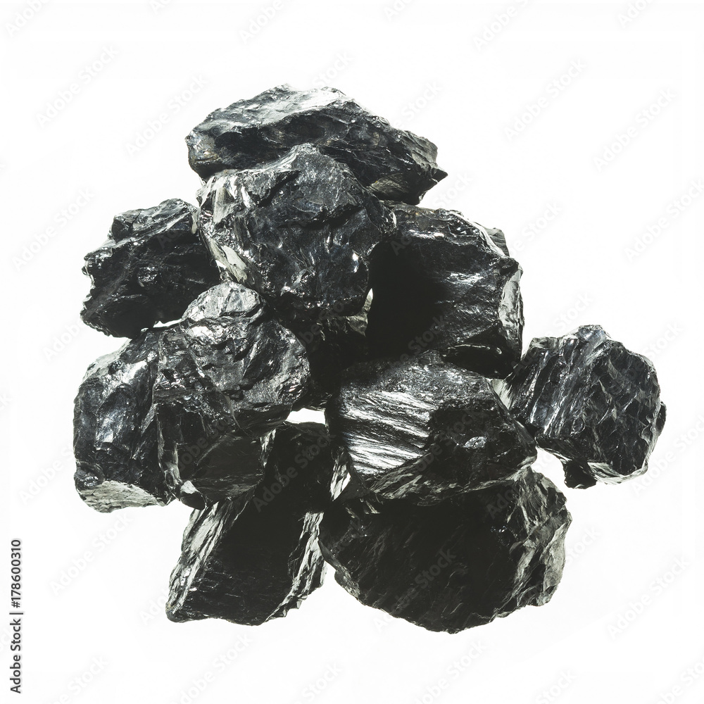 Pile of black coal mine close-up with large depth of field. Anthracite coal bar isolated on white background